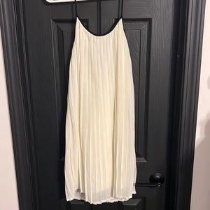 New with tags. Fab’rik brand. Size S. Pleated white/taupe dress w/black straps